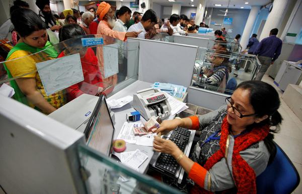 bank desk worker money