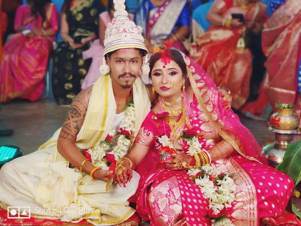 niladri with his wife সদ্য বিবাহিত নীলাদ্রি ও তার স্ত্রী।